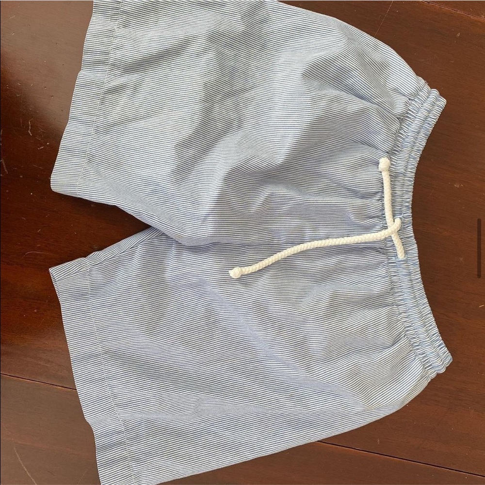 Blue / white striped swim trunks. Tie waist. Lined. 3T